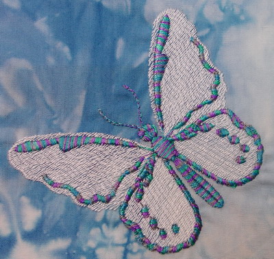 This pretty butterfly was designed & stitched in Aurilux by Janice Heitbaum
